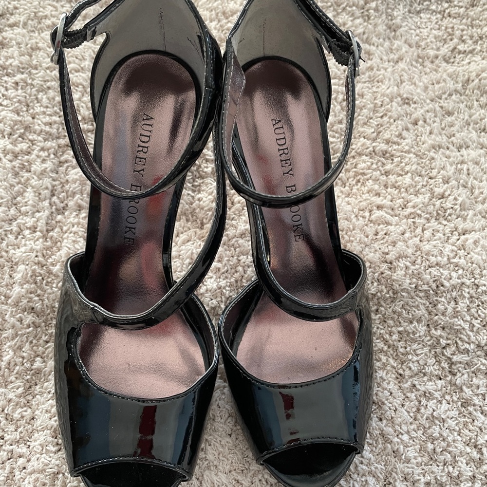 Black open toe shoes. 4 inch heel and ankle strap